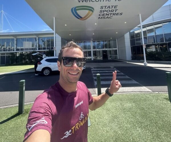 Oriol Gili giving a thumbs up outside a sports centre in Melbourne while coaching on location