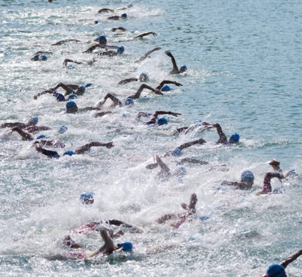 Open water swimmers racing at Lake Banyoles near Girona